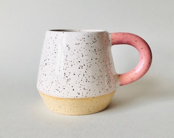 Handmade Mug in Specked White Clay with a Pink Handle