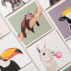 May include: A set of nine greeting cards featuring watercolor illustrations of various animals wearing party hats. The animals include a pug, a red panda, a cow, a llama, a toucan, a parrot, and a dog.