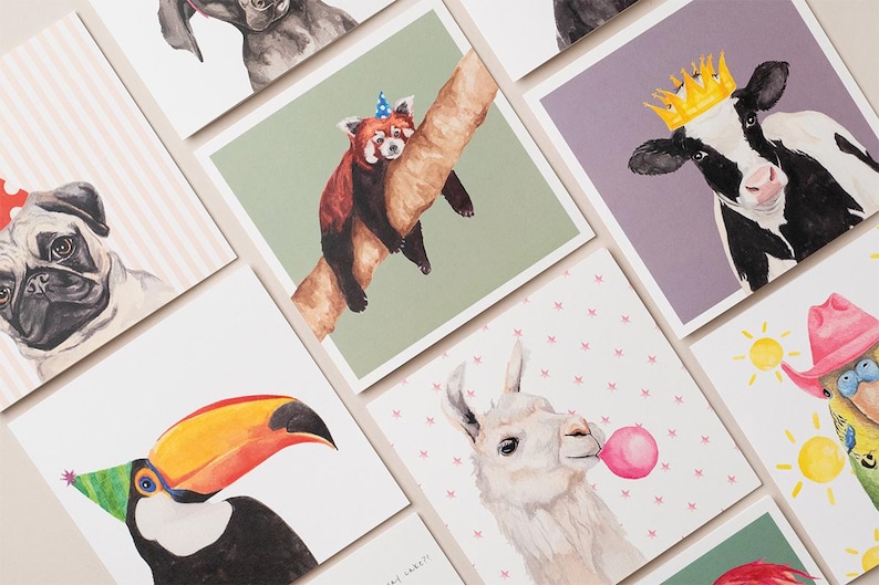 May include: A set of nine greeting cards featuring watercolor illustrations of various animals wearing party hats. The animals include a pug, a red panda, a cow, a llama, a toucan, a parrot, and a dog.