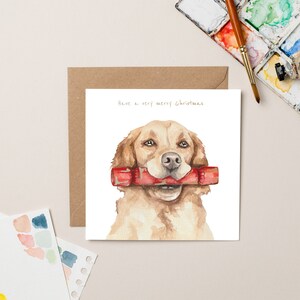 Golden Retriever con biglietto di Natale cracker con lamina d'oro
