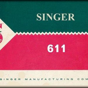 Puede incluir: Una caja de máquina de coser Singer vintage con un diseño verde y rojo. La caja tiene el texto "SINGER" y "611" impreso en ella. El texto "THE SINGER MANUFACTURING COMPANY" está impreso en la parte inferior de la caja.