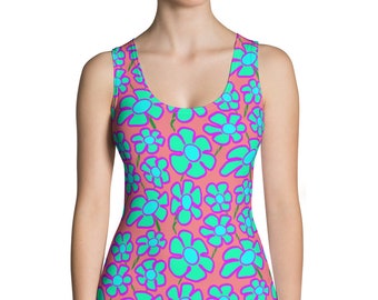 May include: A pink tank top with a floral pattern. The flowers are turquoise blue with purple outlines.