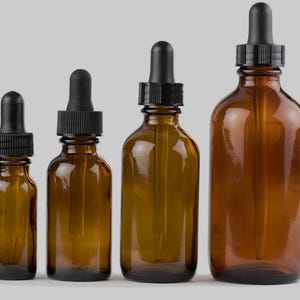 Botella de vidrio redonda ámbar con gotero de vidrio con bulbo negro. Elija el tamaño de la botella: 1/2 oz, 1 oz o 2 oz, 4 oz
