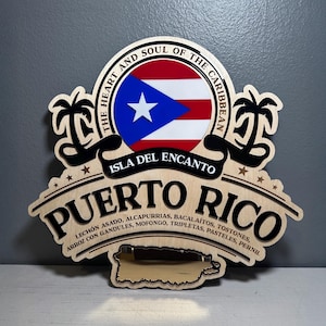 May include: Wooden sign featuring the Puerto Rican flag and the words "Puerto Rico" in bold letters. The sign includes the text "The Heart and Soul of the Caribbean" and a list of traditional dishes.