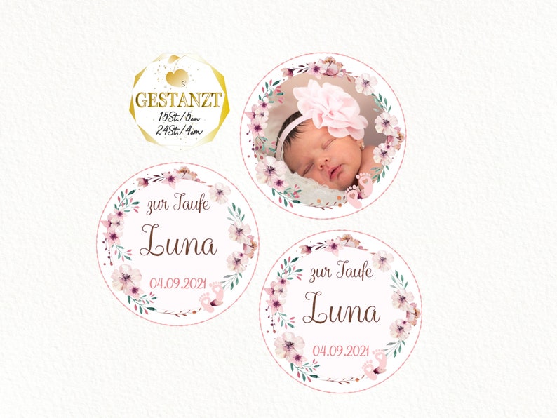 May include: Three round pink and green floral themed stickers with the text "zur Taufe Luna 04.09.2021". One sticker features a baby girl sleeping in a pink floral wreath.