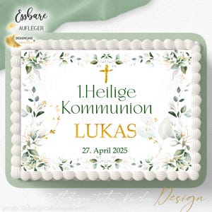 Könnte beinhalten: Weisser Kuchen mit grünem und goldenem Blumenrand und einem goldenen Kreuz. Der Text auf dem Kuchen lautet "1. Heilige Kommunion LUKAS 27. April 2025".
