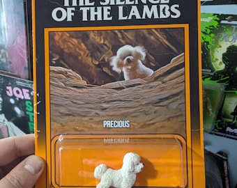 Lammens tystnad, actionfiguren Precious hunden