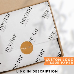 May include: White tissue paper with a repeating pattern of the text "nec/tar A BALANCED WELLNESS SPA". A gold circle with the text "nec/tar" is visible in the center of the image. The text "CUSTOM LOGO TISSUE PAPER" is visible in the lower right corner of the image. The text "LINK IN DESCRIPTION" is visible in the lower left corner of the image.