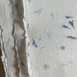 Handmade artisan Paper with blue cornflower petals, natural textured with deckle edges ethically produced with plant fibers & blue flowers