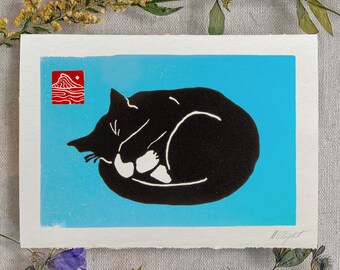 Black cat on blue, sleeping curled holding paw to his face linocut void cat blockprint tiny art print for cat lovers, feline pet owner gift