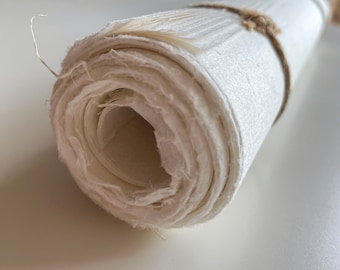 Handmade artisan mulberry Paper, delicate natural textured with deckle edges, produced with white plant fibers from tree bark and rice straw