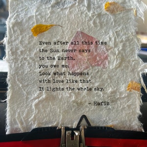 Handtyped love poem of Hafiz or Hafez art poetry typed on handmade artisan pressed flowers papers, inspirational qoute on vintage typewriter