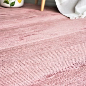 Luxurious viscose rug: Soft, silky and stylish home decor accent, available in various sizes and colors.