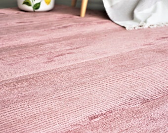 Luxurious viscose rug: Soft, silky and stylish home decor accent, available in various sizes and colors.