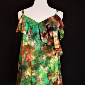 Small ice dye off the shoulder ruffled blouse top in green, orange, and purple galaxy design. Pretty tie dye shirt