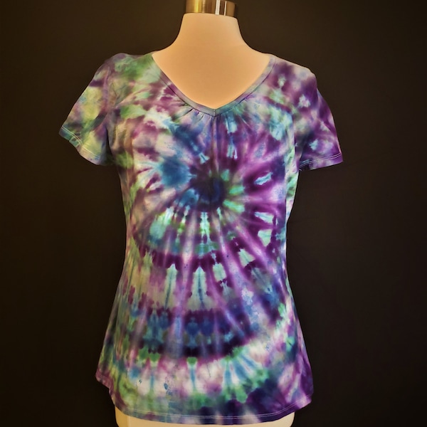 Custom made ladies ice tie dye shirred v-neck t-shirt in blue, purple, and green swirl. Made to order sizes S-5X