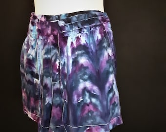 Small ice dye elastic waist drawstring shorts in blue and purple. Soft, comfortable tie dye cotton.