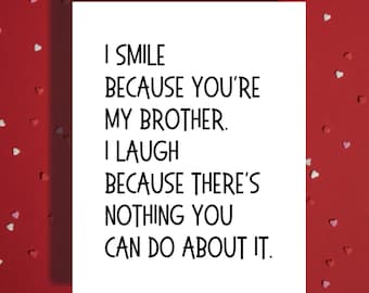 May include: A white card with the text "I SMILE BECAUSE YOU'RE MY BROTHER. I LAUGH BECAUSE THERE'S NOTHING YOU CAN DO ABOUT IT." is displayed on a red background scattered with heart-shaped confetti.
