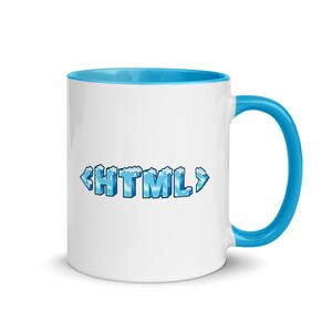May include: White ceramic mug with a blue rim and handle. The mug features the text "<HTML>" in blue with a frosted, icy design.