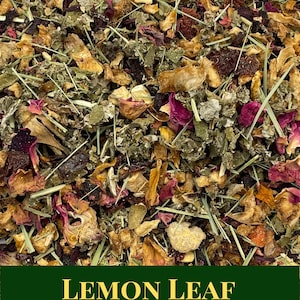 May include: Close-up of a blend of dried herbs, fruits, and flowers. The mix includes green leafy herbs, dried rose petals, orange peel, and other ingredients. The text "LEMON LEAF" is displayed on a green banner.