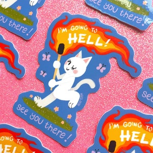 May include: A set of five stickers featuring a white cat with a mischievous expression. The cat is holding a lit match and a sign that reads "I'm going to hell!" The stickers are on a pink glitter background.