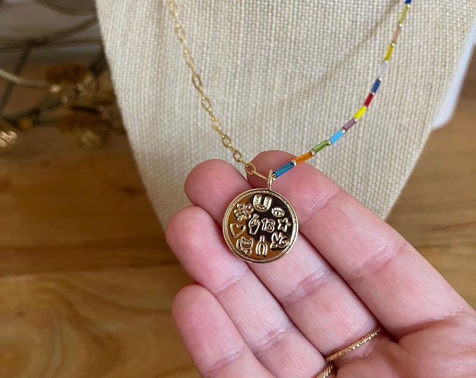 Half beaded multicolored beaded and paperclip link chain and lucky charm pendant