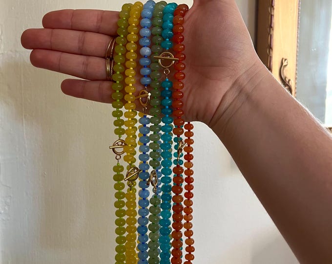 Beaded toggle necklace with charm
