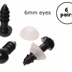 Op de afbeelding: Zwarte veiligheidsoogjes van kunststof voor knutselwerk, 6 paar. De ogen zijn 6 mm groot en bevatten witte kunststof ringen voor een veilige bevestiging. Perfect voor knuffels, poppen en andere handgemaakte projecten.