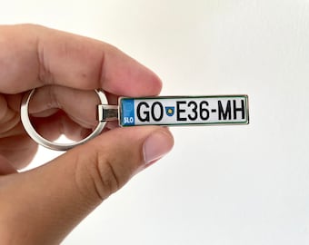 Personalized, custom made keyring with any country number plates, name, car model or phone number. Two sided. Slovakia license plate keyring