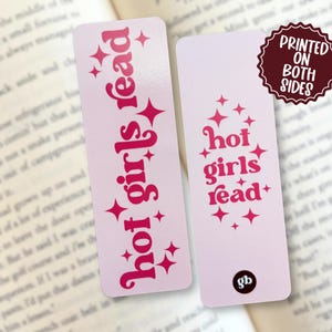 May include: Two rectangular bookmarks with a light pink background and dark pink text. One bookmark features the vertical text 'hot girls read' with star accents. The other displays the same text stacked horizontally with stars and a small 'gb' logo.