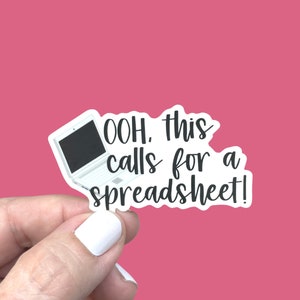 May include: A white laptop sticker with the text "OOH. this calls for a spreadsheet!"