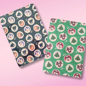 May include: Two sheets of wrapping paper with different holiday themes. One sheet is black with a glittery finish and features a repeating pattern of pumpkins, ghosts, and black cats. The other sheet is green with a repeating pattern of Christmas trees, snowmen, and reindeer.