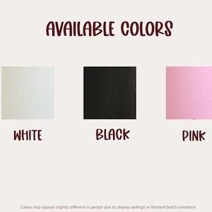 May include: A color chart titled AVAILABLE COLORS featuring three square swatches in white, black, and pink with corresponding labels below each. A disclaimer at the bottom states colors may appear slightly different in person.