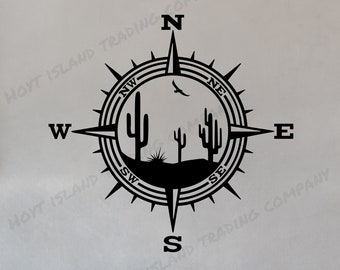 May include: Black and white compass design with a desert landscape featuring cacti and a bird in flight. The compass points north, south, east, and west with the cardinal directions labeled in black.