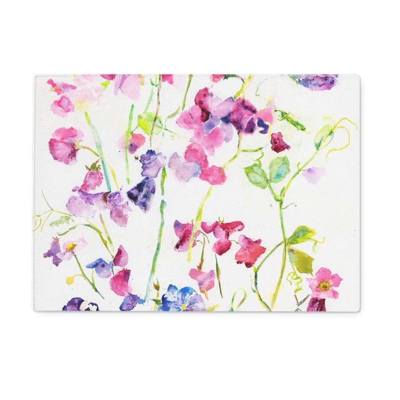 Protect worktops with a beautiful glass worktop saver with a lovely design of a watercolour painting of sweetpeas. Gorgeous in any kitchen or a perfect housewarming gift. Can also be used as a cheese board or as a heat resistant serving platter. Affordable yet luxurious this collection of glass worktop savers make perfect gifts for Mum