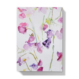 An A5 journal with a decorative design of sweet peas on the cover. This hardbacked journal is available plain and unlined.