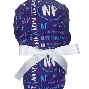 May include: Purple scrub hat with a white bow and the text "NP Nurse Practitioner" repeated in a pattern. The hat has a white circle with the letters "NP" in blue.