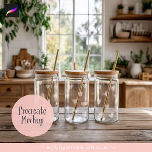 May include: Three clear glass jars with wooden lids and gold straws, each decorated with white heart patterns. The jars are arranged on a wooden table. The image includes the text "Procreate Mockup".