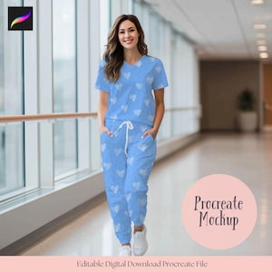 May include: A light blue scrub set with a white heart pattern. The set includes a V-neck top and drawstring pants. The image also includes the text "Procreate Mockup" and "Editable Digital Download Procreate File".