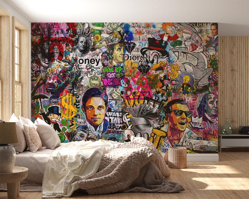May include: A vibrant, multi-colored mural featuring a collage of pop culture icons, money symbols, and graffiti art. The artwork includes portraits, cartoon characters, and the word "money". The mural is displayed on a bedroom wall, with a bed and side table in the foreground.