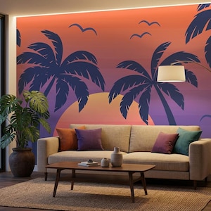 May include: A beige sofa with orange, purple, and teal throw pillows sits before a wall mural featuring a sunset gradient of orange and purple with dark blue silhouettes of palm trees and birds. A wooden coffee table holds two ceramic vases.