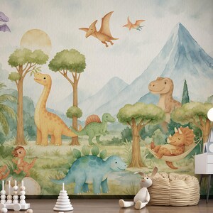 May include: A watercolour mural with a dinosaur theme. The artwork shows various dinosaurs, trees, mountains, and flying pterodactyls in a soft, pastel colour palette. The scene creates a playful and imaginative atmosphere, suitable for a child's room.