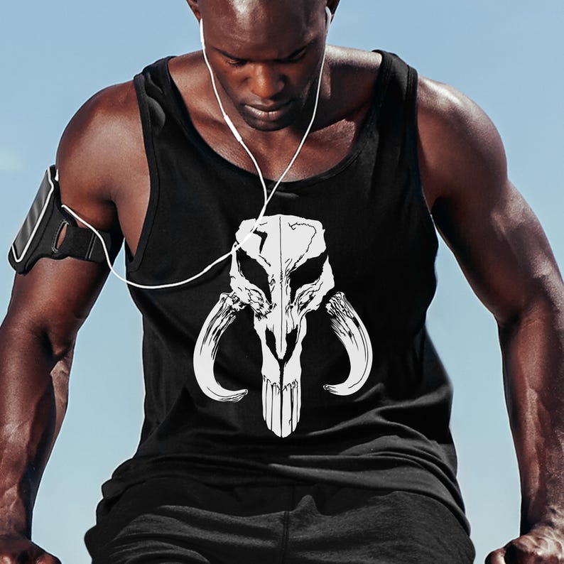 May include: A black tank top with a white Mandalorian symbol printed on the front. The symbol is a skull with horns and a design that resembles a helmet.