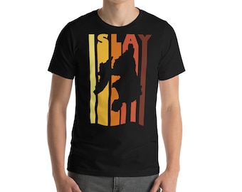 May include: Black t-shirt with a retro-style graphic of a person with the word "SLAY" printed above them.