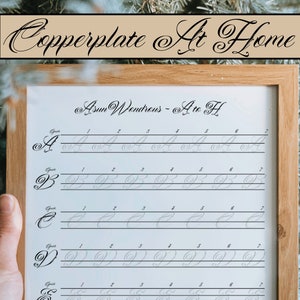 May include: A framed printable worksheet for practising copperplate calligraphy. The worksheet features the letters A through F with lines for practising each letter.