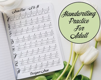May include: A white notebook with a handwriting practice sheet for adults. The sheet features a cursive alphabet from A to H with lines for practicing each letter. The title of the sheet is "Asun Flow - A to H". The notebook is open and lying on a white surface with white tulips.