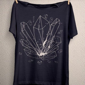 May include: A dark blue t-shirt with a white graphic of geometric crystals. The crystals are arranged in a cluster and have a detailed, intricate design.