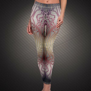 May include: Black leggings with a colorful abstract pattern of lines and curves. The pattern is primarily white, black, and yellow with accents of red, purple, and blue.