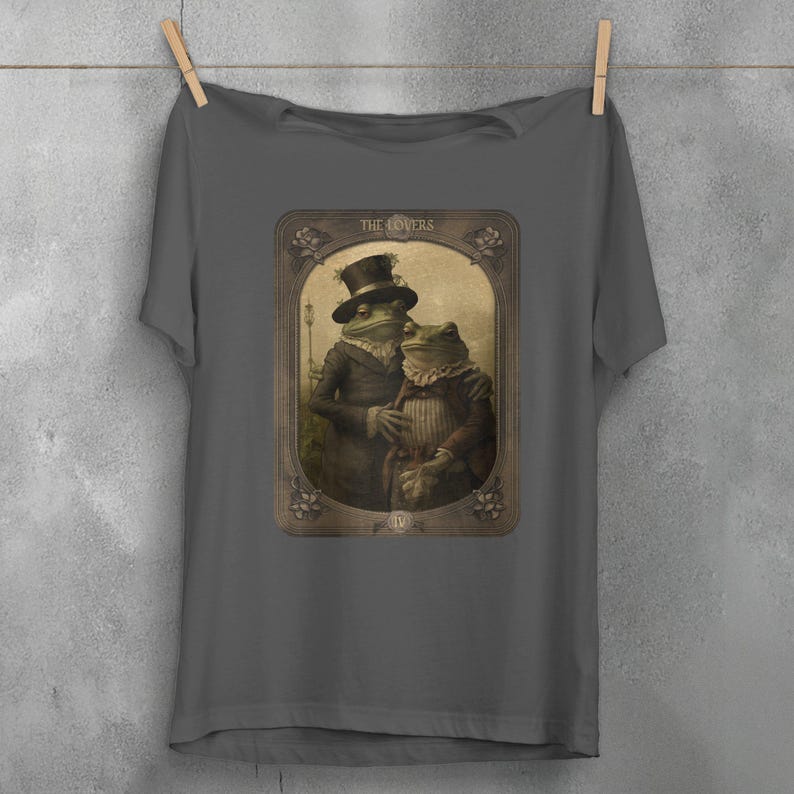 a folded t - shirt with a picture of a man and a woman on it
