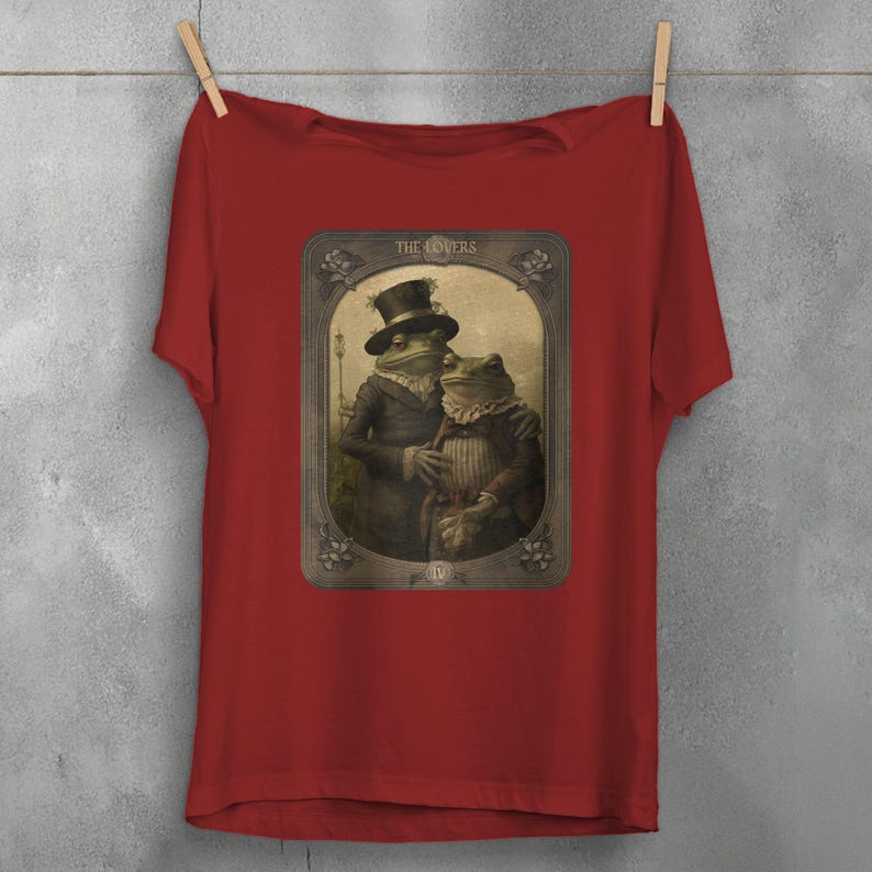 a black t - shirt with a picture of a man and a woman